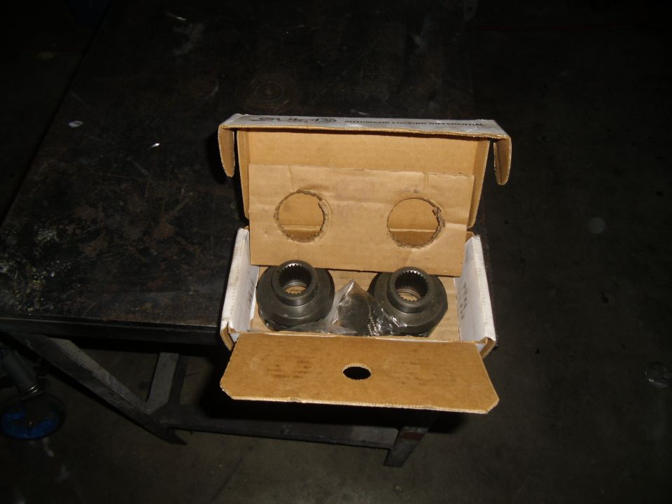 Two metal differential lockers in a cardboard box