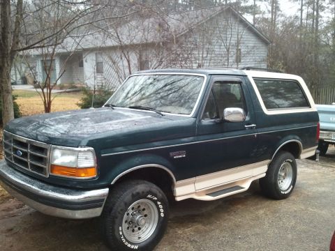 1993 Ford Bronco - This 1993 Ford Bronco is seen from a 3/4 front angle, parked in a driveway.