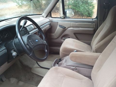 1993 Ford Bronco - Interior of a 1992 Ford F-Series truck, showing the driver's side and passenger's side seats.