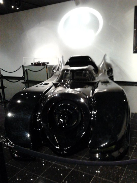 Black Batmobile front view with distinctive fins and circular grille