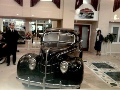 1995 Ford Taurus - A black 1939 Ford Deluxe Coupe is displayed at the Peterson Automotive Museum.