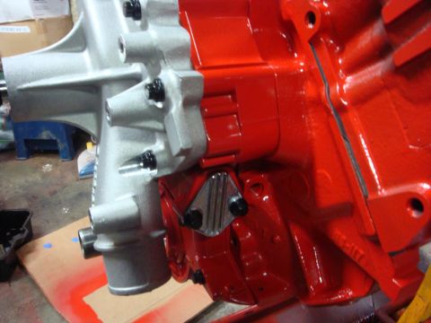 1989 Ford Bronco - Detail of an engine block, showing painted components and bolted sections.