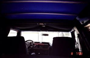 1985 Ford Bronco - Interior view of a vehicle, showing dashboard, steering wheel, and seats.