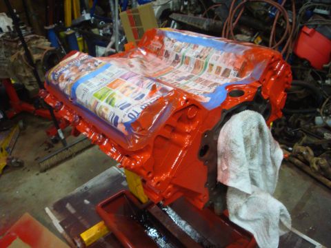 1989 Ford Bronco - Engine block prepared for painting, with newspaper protecting intake manifold area.
