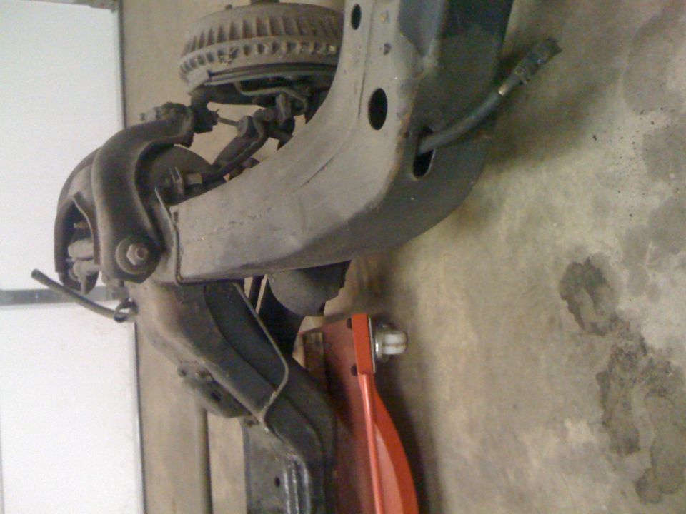 Close-up of a truck's front suspension assembly, possibly from a Ford F-150