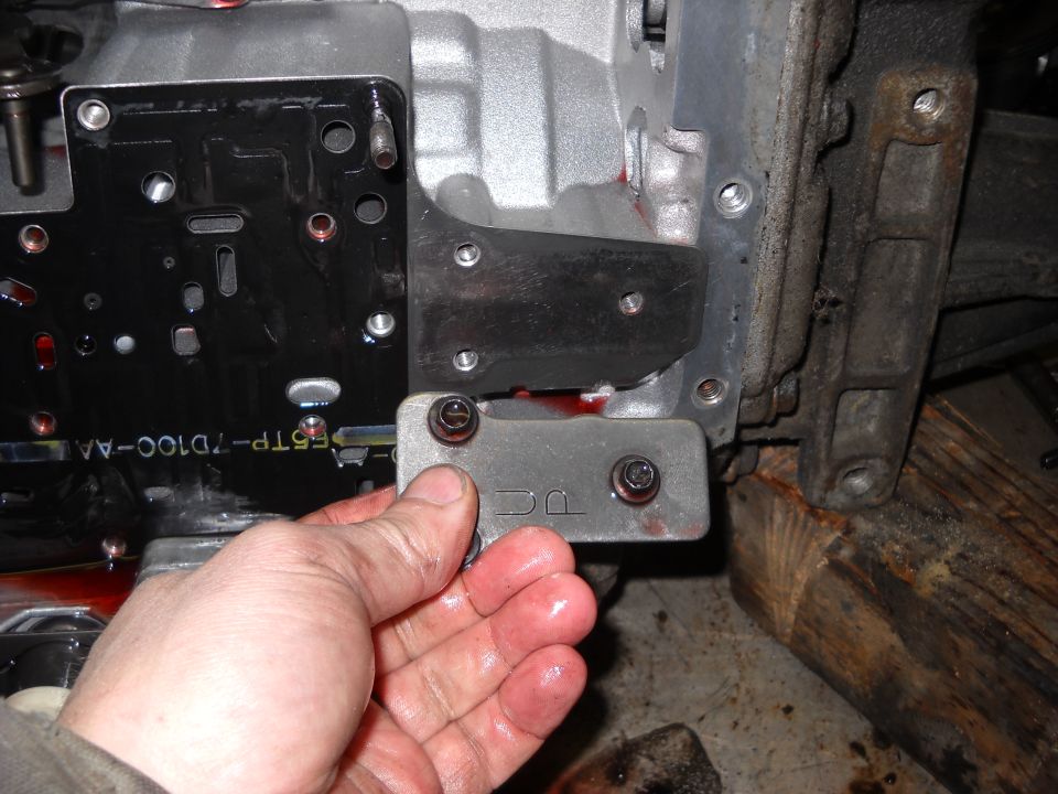 Close-up of a transmission part with DC stamped on it