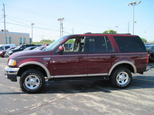 1999 Ford Expedition - Maroon 1999 Ford Expedition with tan lower body trim and roof rack.