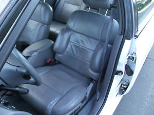 1993 Ford Taurus - Interior view of a car's front seats and dashboard.