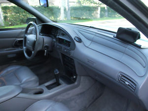 1993 Ford Taurus - Interior view of a 1993 Ford Taurus, highlighting the dashboard and seating.