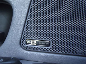 1993 Ford Taurus - Close-up of a car's interior speaker grille with a JBL audio system emblem.