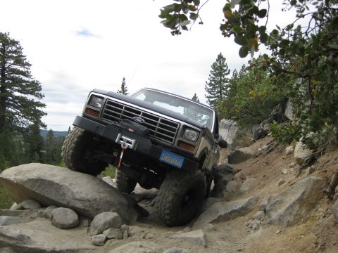1986 Ford Bronco - This 1986 Ford Bronco is tackling a challenging rocky terrain on an off-road adventure.