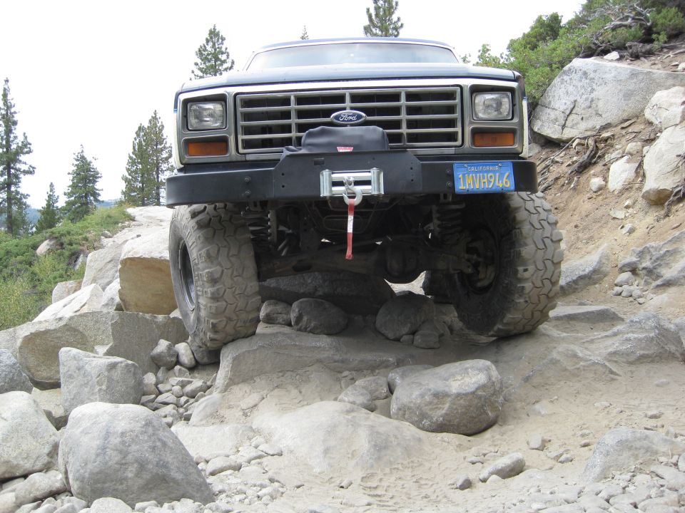 Ford Bronco with winch on rocky trail, California license plate 1MVH946
