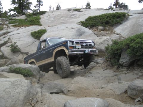 1986 Ford Bronco - This 1986 Ford Bronco tackles a challenging rocky trail, its off-road capabilities.