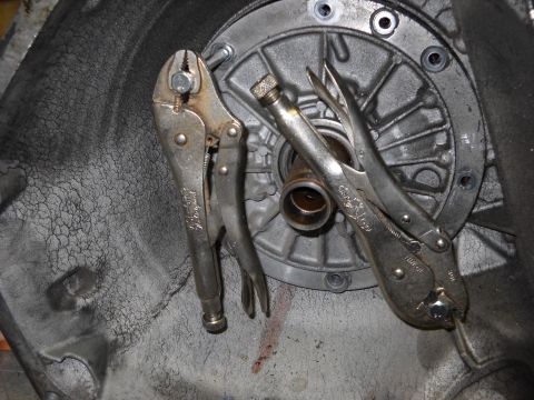 1993 Ford C-150 (Centurion Conversions) - Locking pliers are used to hold parts during a transmission rebuild.