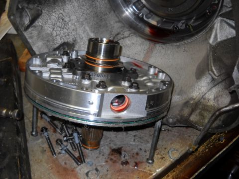 1993 Ford C-150 (Centurion Conversions) - Close-up of a transmission pump assembly, indicating a part replacement or repair process.