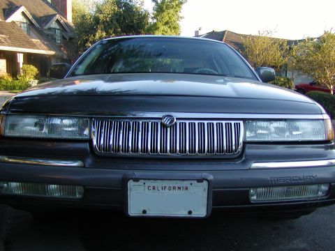 1992 Mercury Grand Marquis - Front view of a 1992 Mercury Grand Marquis, its distinctive chrome grille and California license plate.