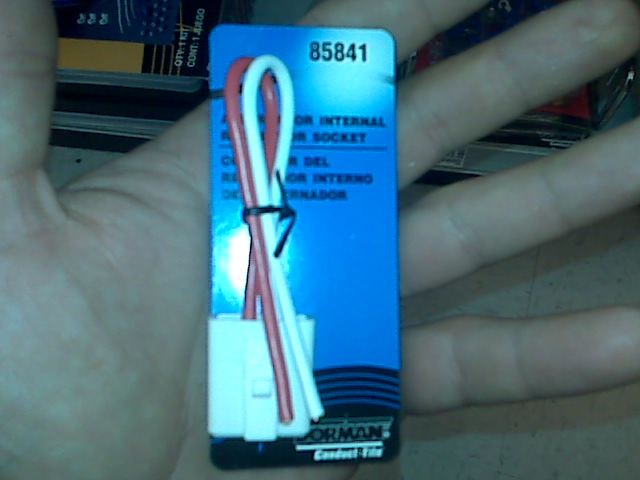 Blue package with white and red wires and a white connector