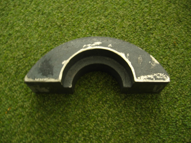 curved metal automotive part with white paint chipping