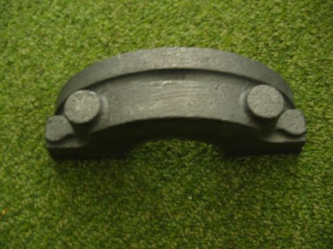1972 Ford Ranchero - Unidentified metal automotive part photographed on a green carpeted surface.