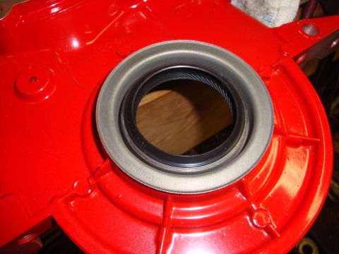 1989 Ford Bronco - Close-up of a red painted engine component a National brand seal.