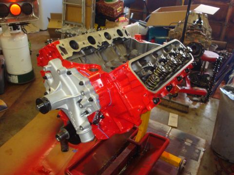 1989 Ford Bronco - A freshly painted V8 engine sits on a stand, ready for installation or further work.