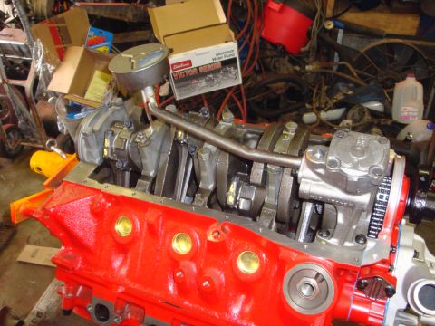 1989 Ford Bronco - Engine block assembly with crankshaft and connecting rods, ready for further work.