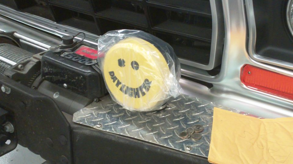 Yellow smiley face day lights on a winch with 'DAY LIGHTS' text