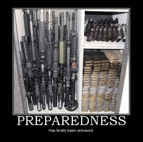 1988 Ford Bronco - A large collection of firearms and ammunition is neatly organized and stored within a gun safe.