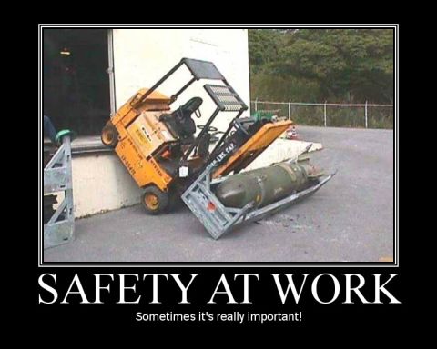 1988 Ford Bronco - A forklift is shown in a dangerous situation, carrying a bomb, with the caption "SAFETY AT WORK".