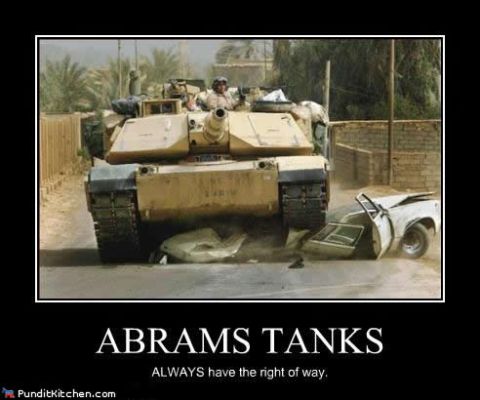 1988 Ford Bronco - An Abrams tank demonstrates its right of way by crushing a car, illustrating a common military saying.