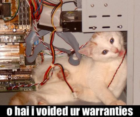 1988 Ford Bronco - A cat has gotten itself tangled in computer wires inside a computer case, with the text 'o hai i voided ur warranties' below.