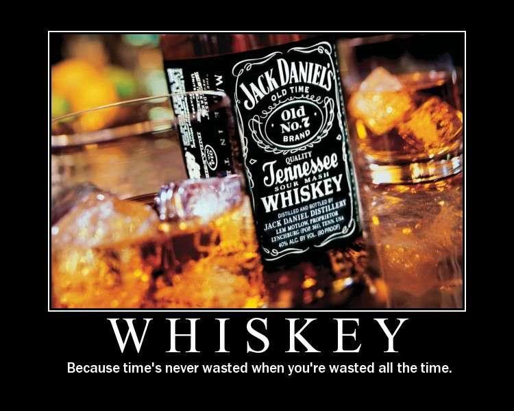 Jack Daniel's Old No. 7 Tennessee Whiskey bottle next to glasses with ice and whiskey