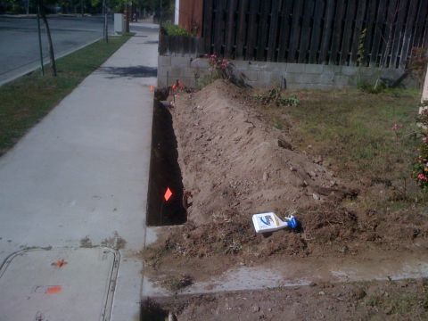 1968 Ford Mustang - Construction or utility work has resulted in a trench along the sidewalk.