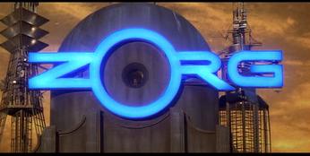 2000 Mercury Grand Marquis - A futuristic building features a prominent glowing blue 'ZORG' logo against a hazy sky.