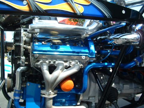 1993 Ford Taurus - The engine bay features custom blue piping and a polished intake manifold.