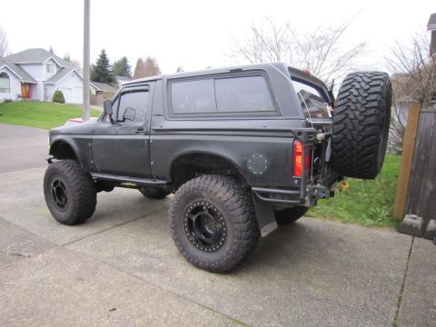1996 Ford Bronco - Modified 1996 Ford Bronco with off-road tires and custom rear bumper.
