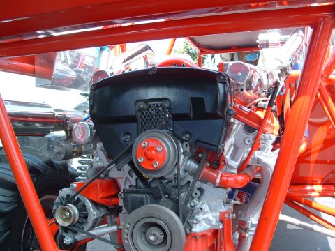 1993 Ford Taurus - Close-up view of a custom engine with prominent red components and a black cover.