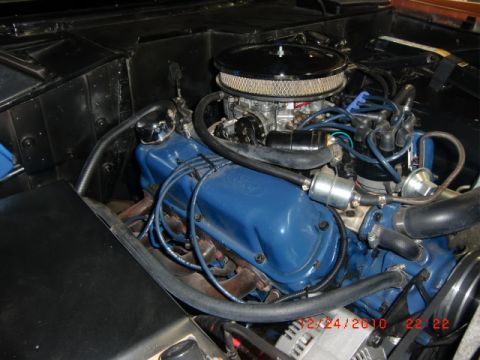1973 Ford Bronco - Close-up of a Ford V8 engine, likely from a classic vehicle, showing engine components.