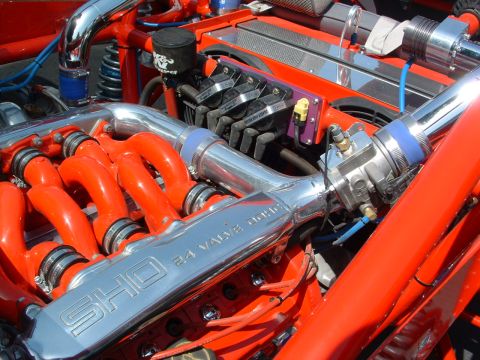 1993 Ford Taurus - The engine bay features a "SHO 24 VALVE DOHC" inscription on the valve cover, indicating a performance-oriented setup.
