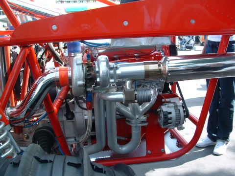 1993 Ford Taurus - Close-up view of a custom engine with a turbocharger and exhaust system.