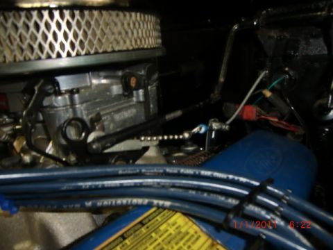 1973 Ford Bronco - Close-up view of an engine bay, showing the carburetor and air filter assembly.