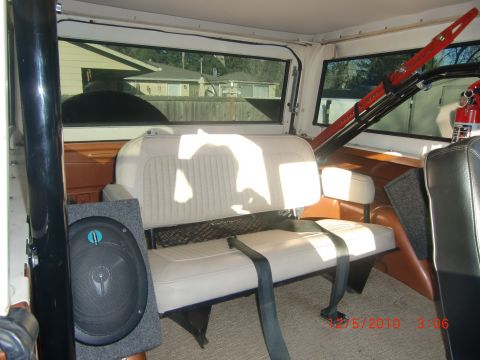 1973 Ford Bronco - Interior view of a 1973 Ford Bronco, rear seating and aftermarket audio equipment.