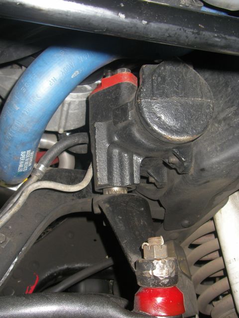 1990 Ford Bronco - This photo shows a close-up view of a vehicle's steering gear box and related suspension parts.