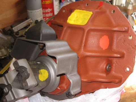 1968 Shelby GT500 - Close-up of a differential housing with painted markings and a drive shaft yoke attached, likely in a workshop setting.