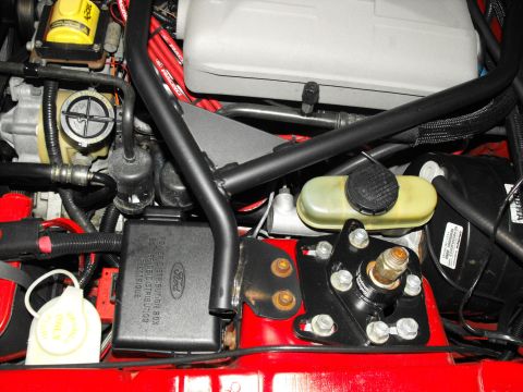 1994 Ford Bronco - Close-up view of an engine bay, showing various components and wiring.
