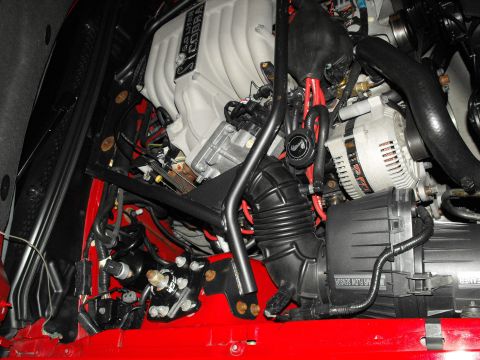 1994 Ford Bronco - Close-up of a vehicle's engine bay, a "COBRA" intake manifold and various engine components.