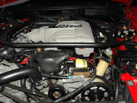 1994 Ford Bronco - Close-up view of a V8 engine bay, the intake manifold and various engine components.