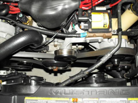 1994 Ford Bronco - Close-up view of an engine bay, with the word "MUSTANG" clearly visible on the radiator cover.