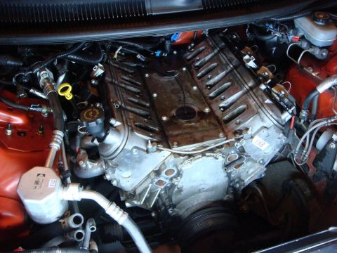 2001 Pontiac Trans Am - Close-up view of a V8 engine installed in a vehicle, showing various engine components and plumbing.