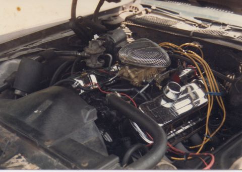 1968 Ford Mustang - Engine bay of a 1968 Ford Mustang, a V8 engine with chrome accents.